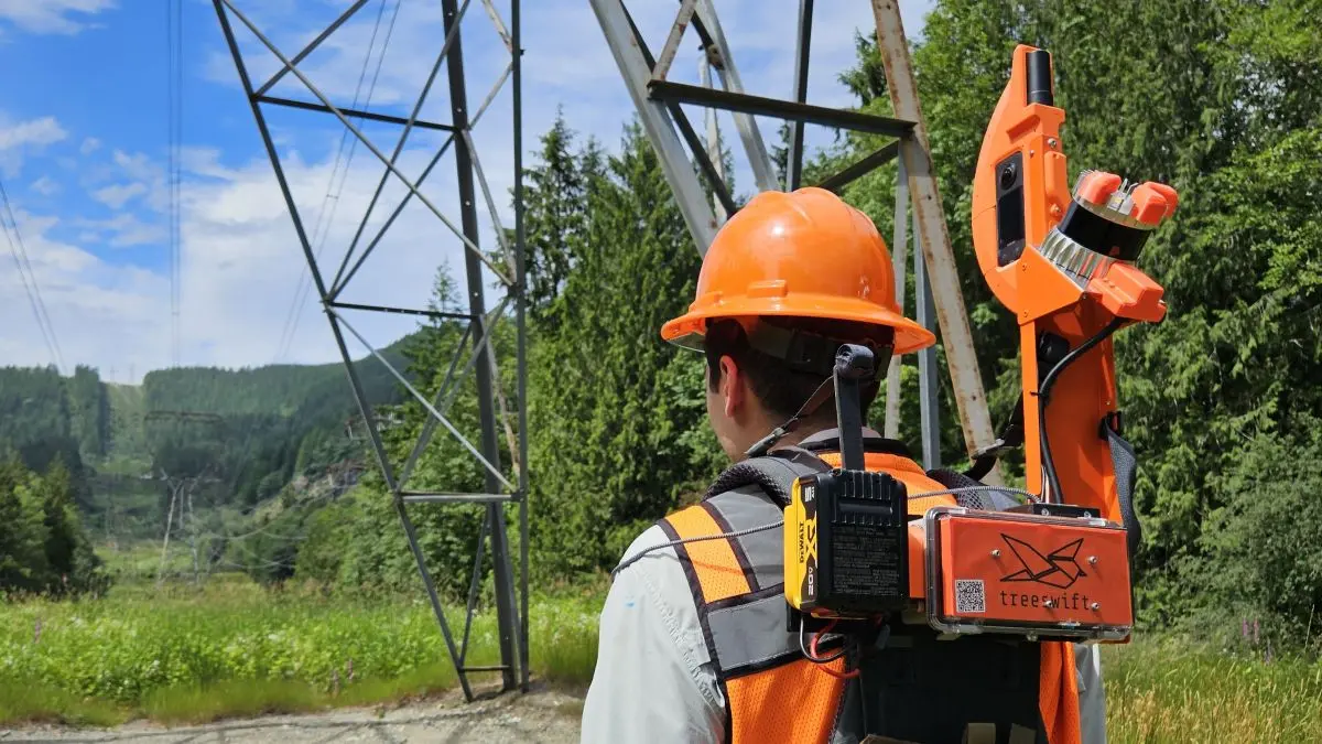 Utility Field Technician Wearing Treeswift Swiftpack AI Powered LiDAR Device During Vegetation Management Inspection